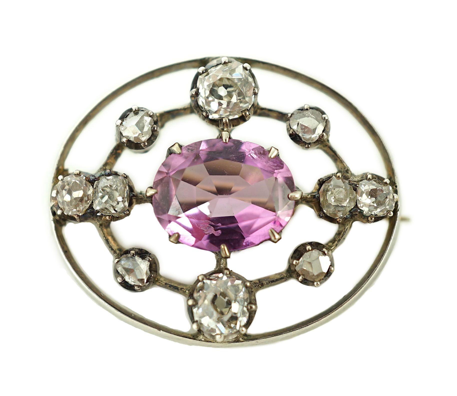 A 19th century gold and silver, pink topaz and diamond set openwork oval brooch